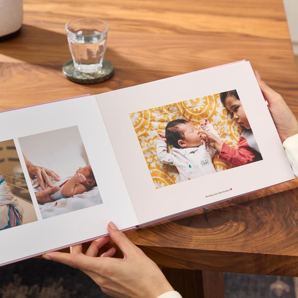 Newborn photos in a personalised baby photo book