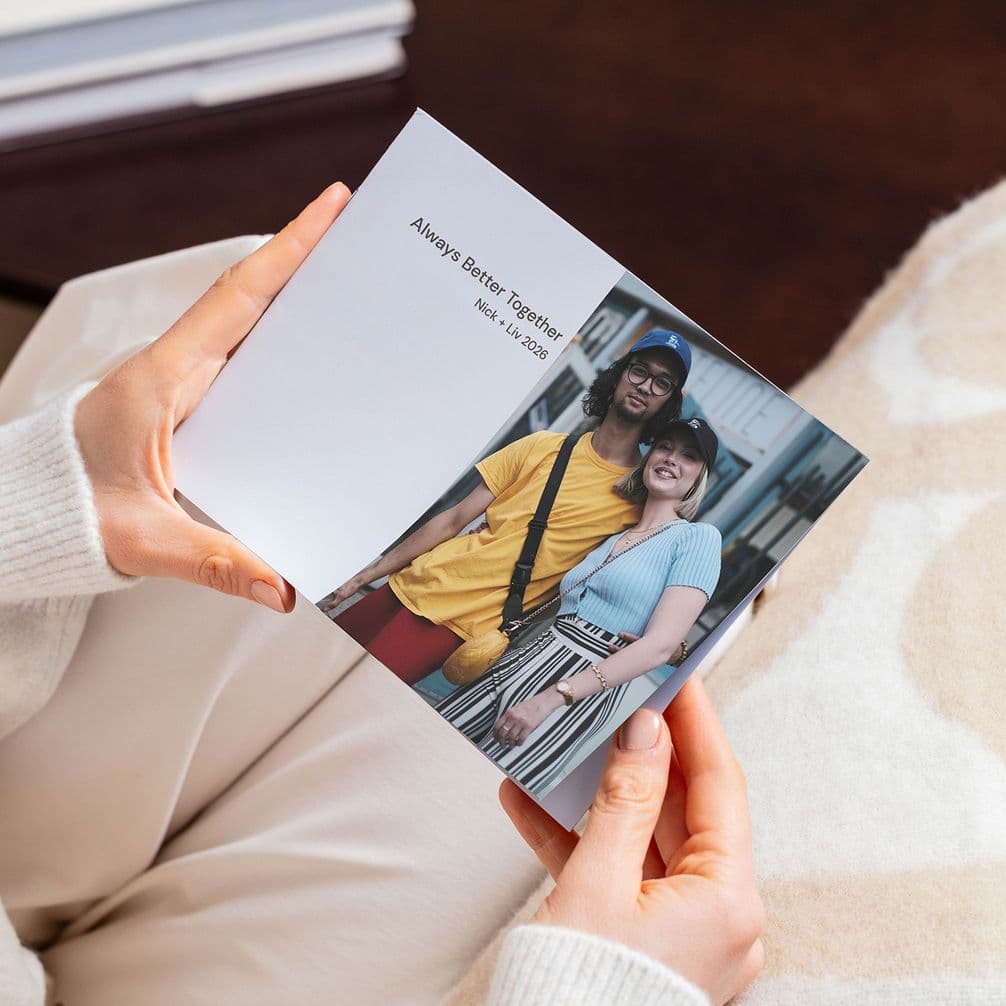 A couple on the front of a small softcover photo book