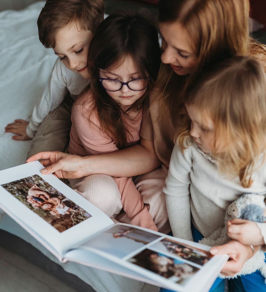 Kids looking inside a personalised mothers day photo book