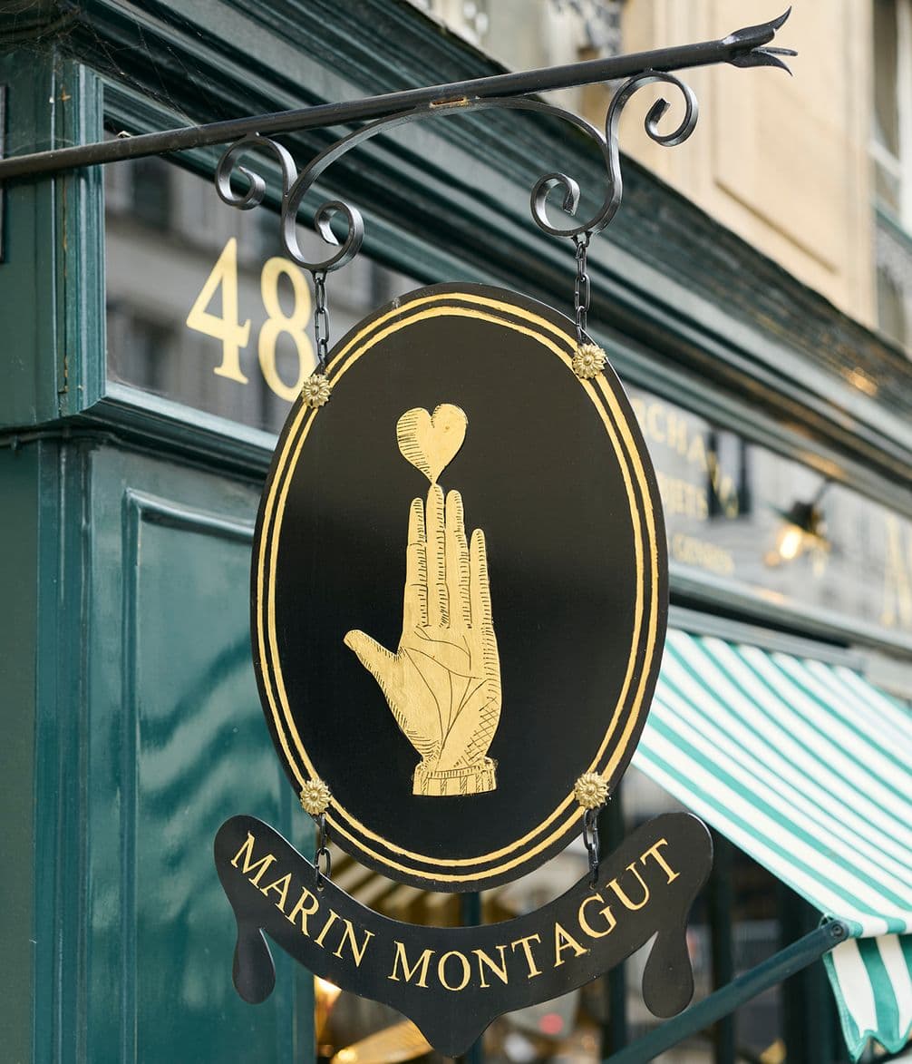 Marin Montagut shop sign with hand and love heart logo