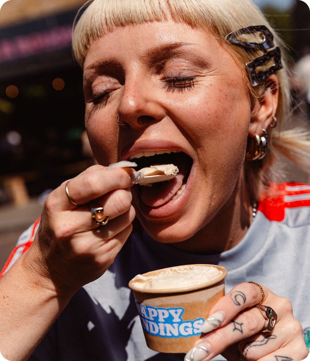 Woman eating a tub of ice cream