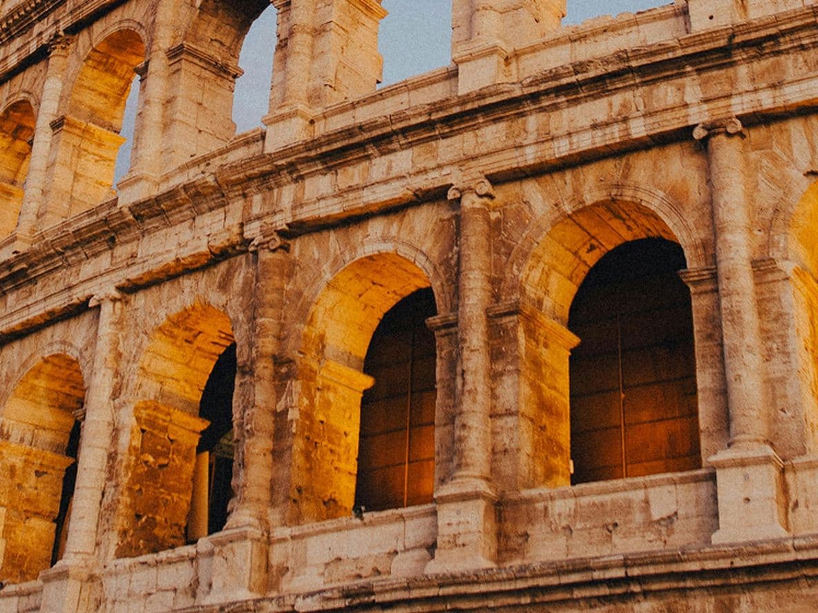 The Roman Colosseum with a dark grey sky behind it