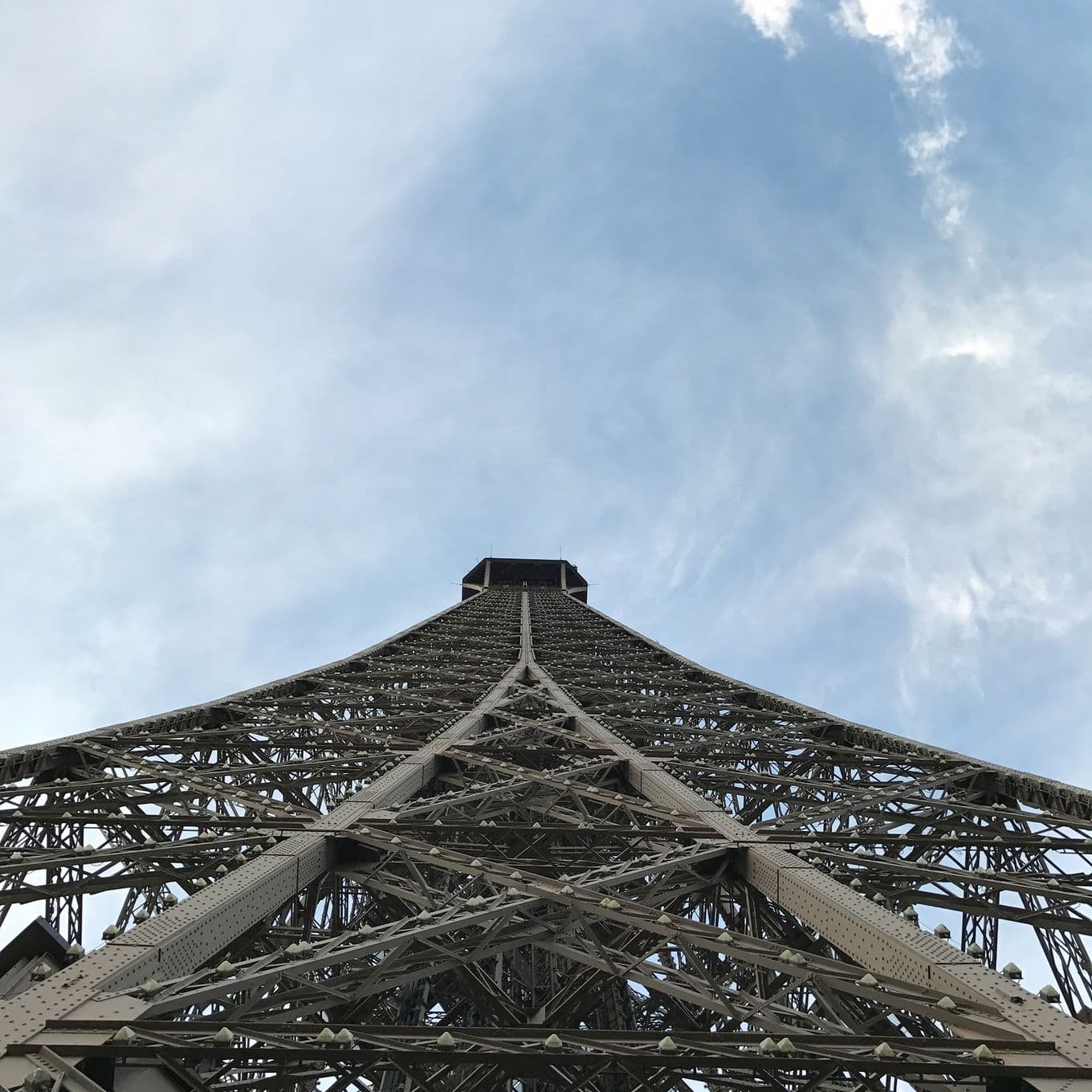 A low angle photograph of the Eiffel Tower, Paris
