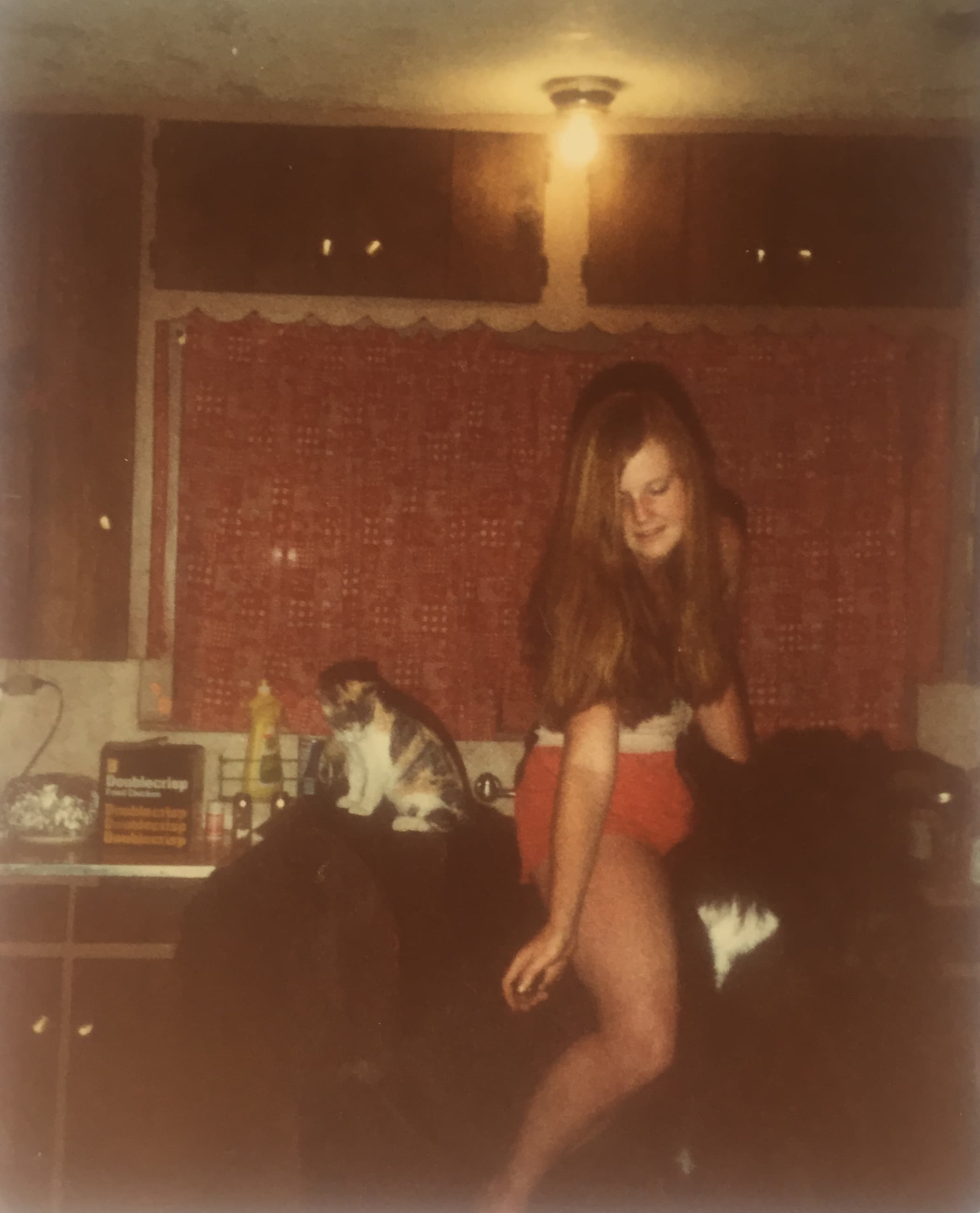 An old photograph of a 9-year-old Staci Layne Wilson in her family home