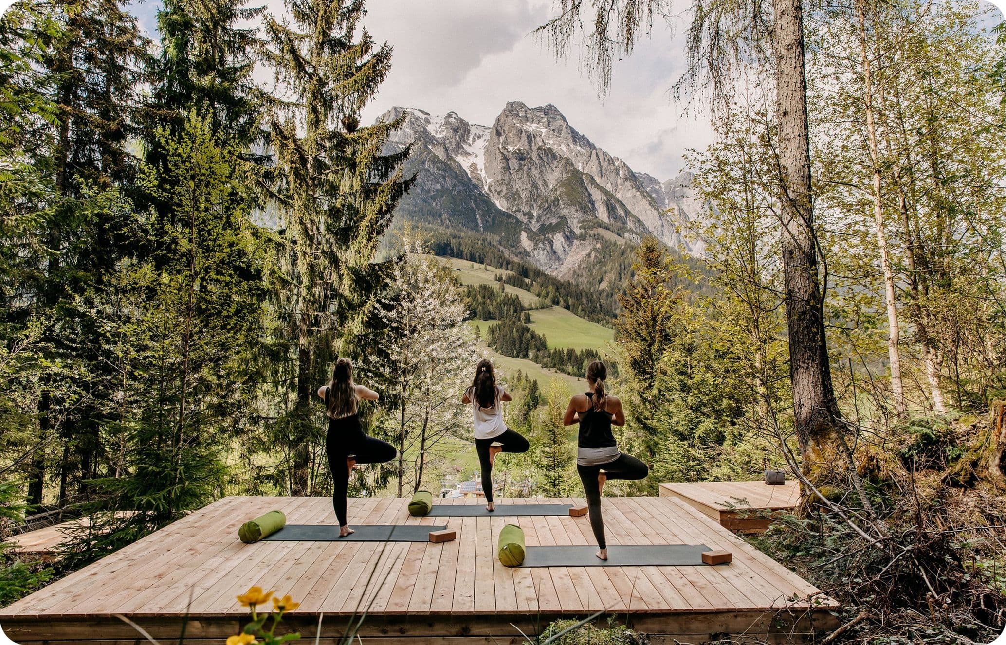 Outdoor yoga with sweeping mountain views in Austria