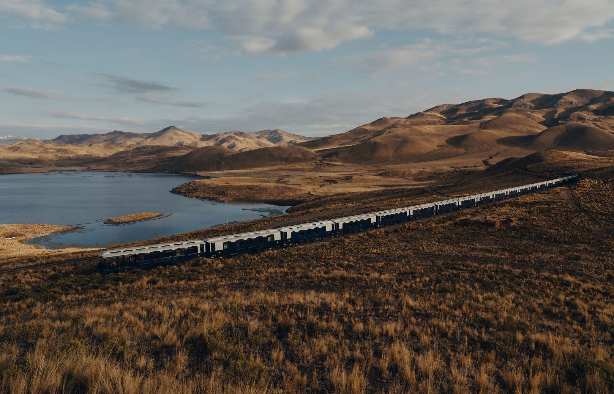 Andean Explorer cutting through a lush landscape in Peru