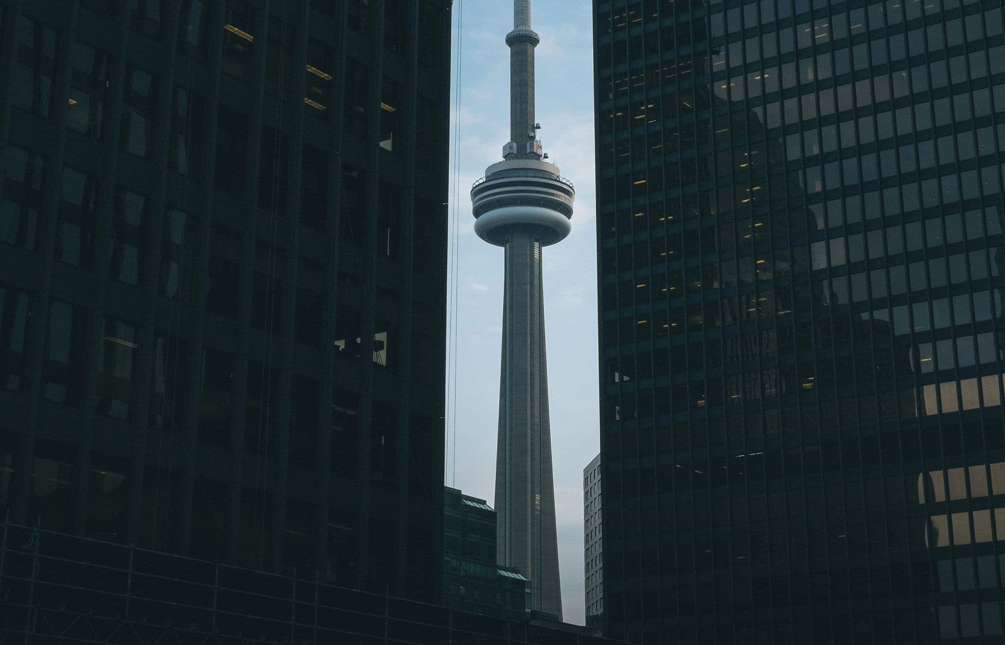 CN Tower Toronto framed between two buildings