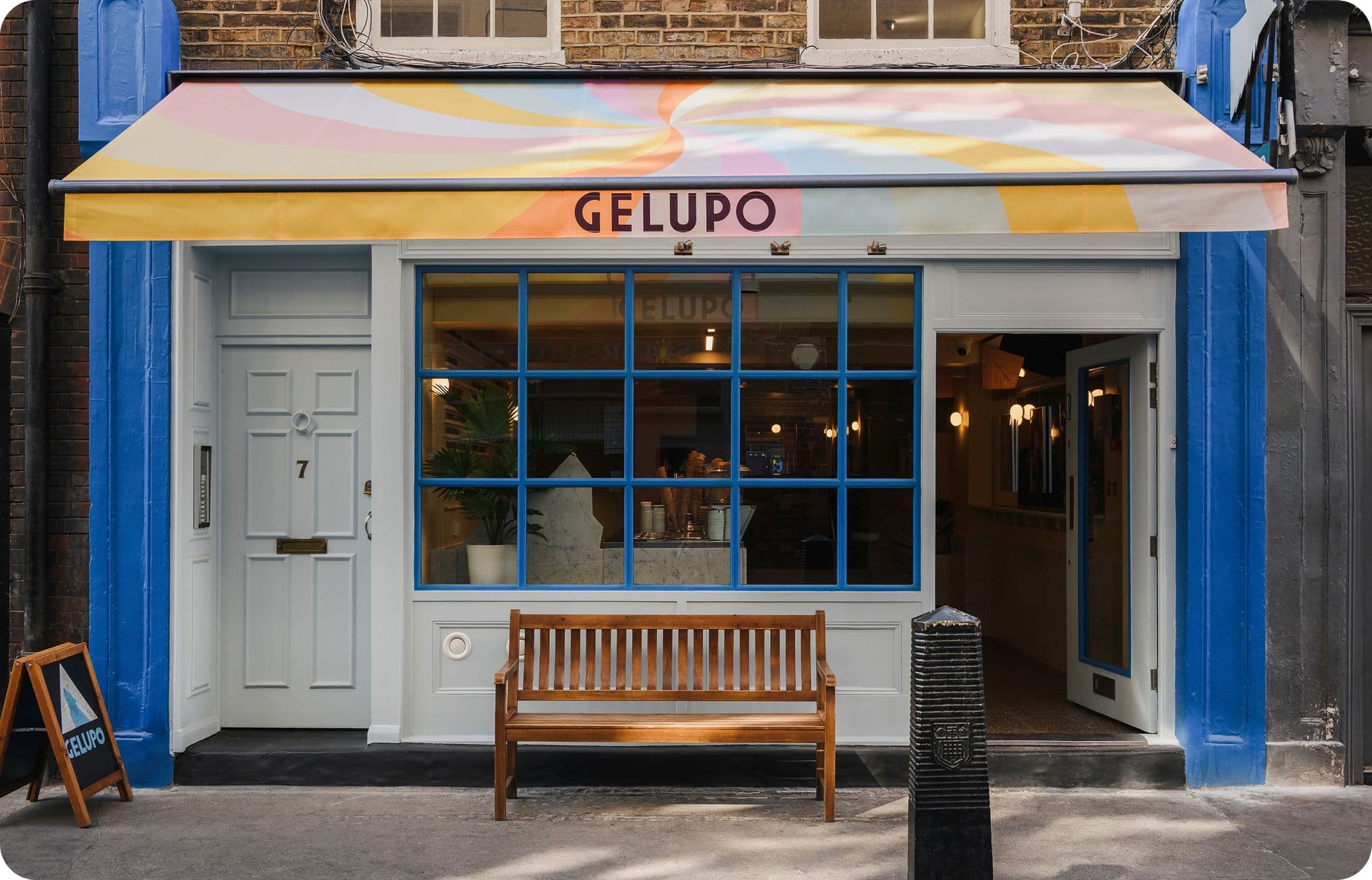 Blue exterior with colourful awning at Gelupo in Soho