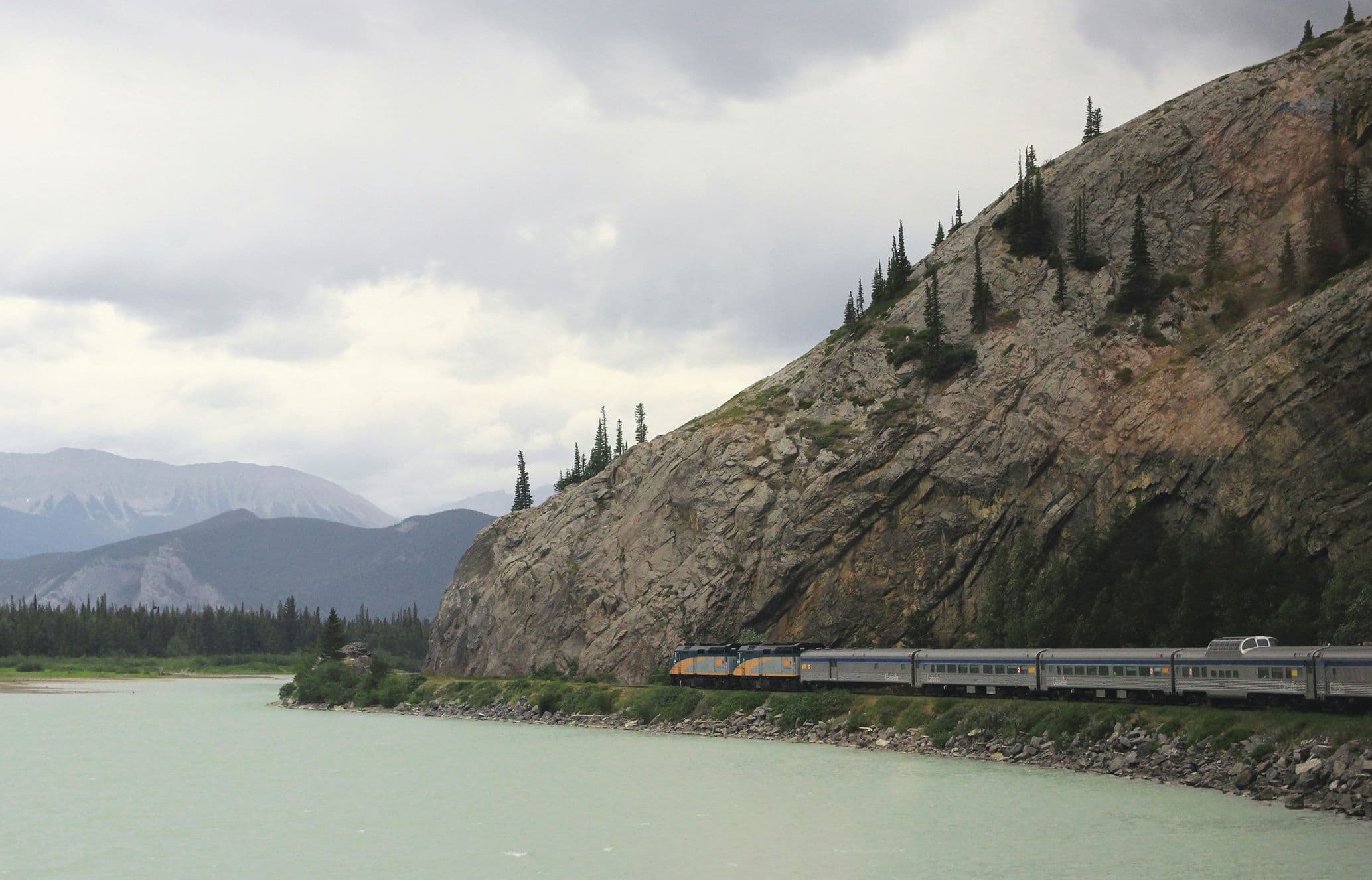 The Skeena train skirting alongside a lake in Canada