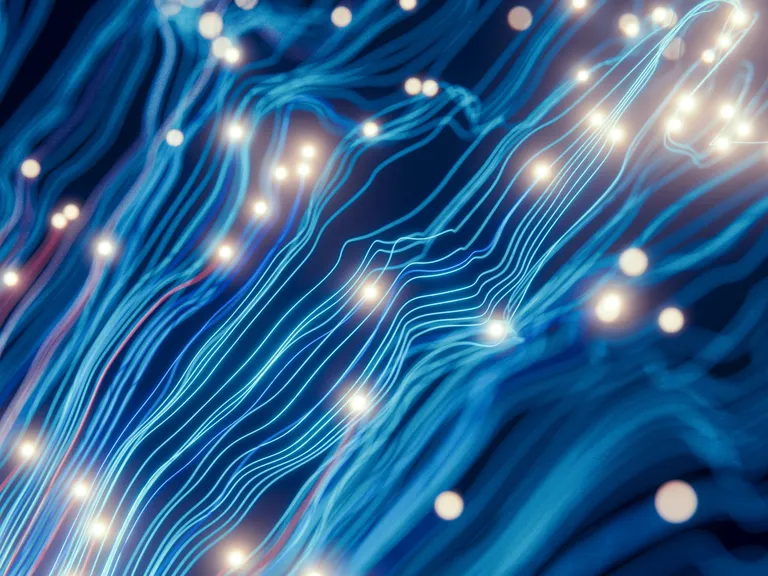 Abstract blue wavy lines resembling data cables or neural pathways, interspersed with bright glowing dots on a dark background.