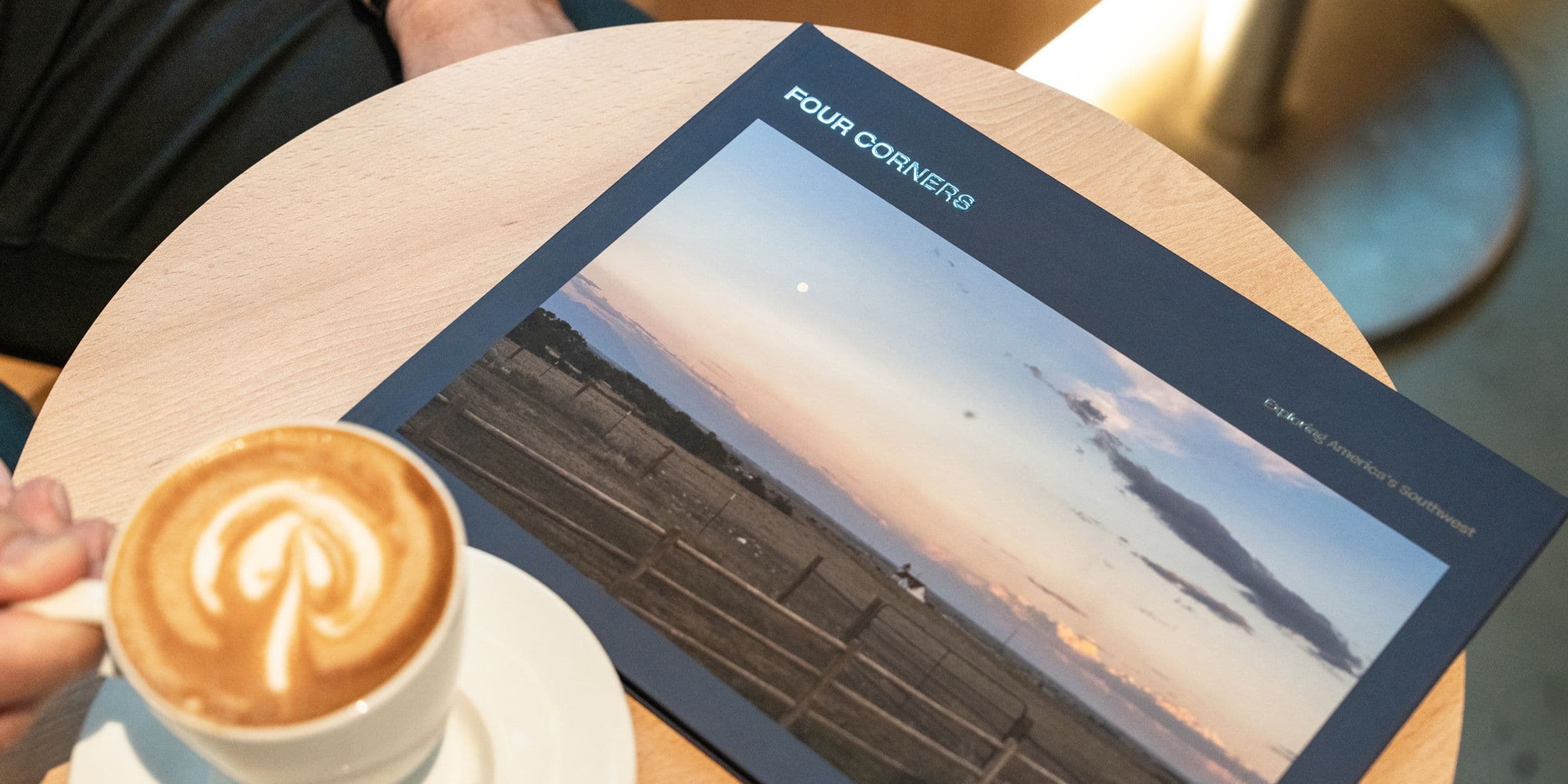 California road trip photo book with coffee
