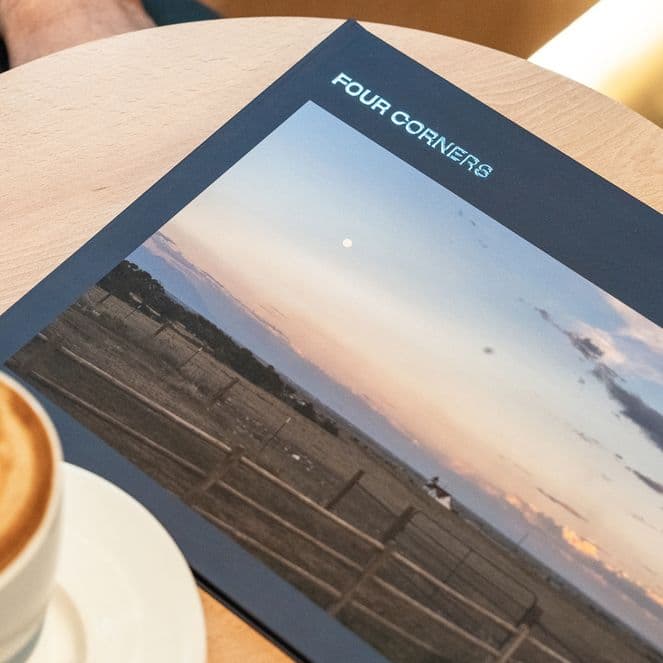 California road trip photo book with coffee