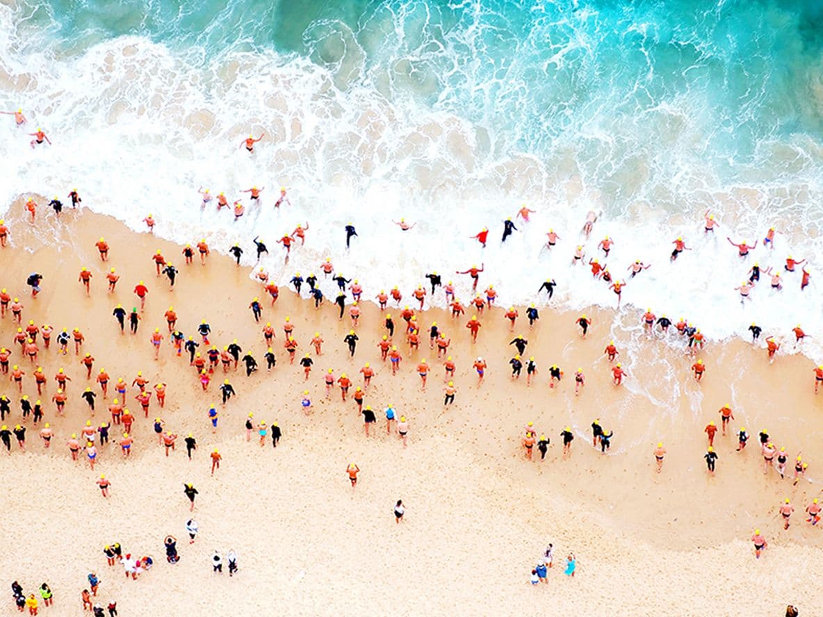 Swimmers run into the water at Bondi Beach, Australia