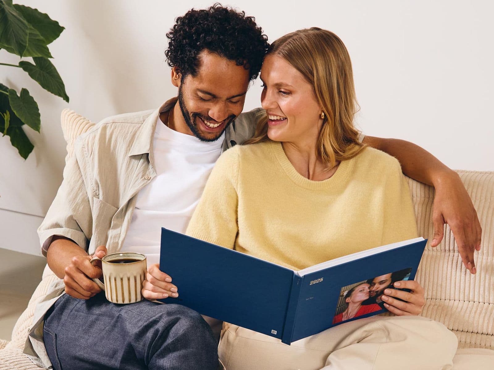Couple looking through a year in review photo book
