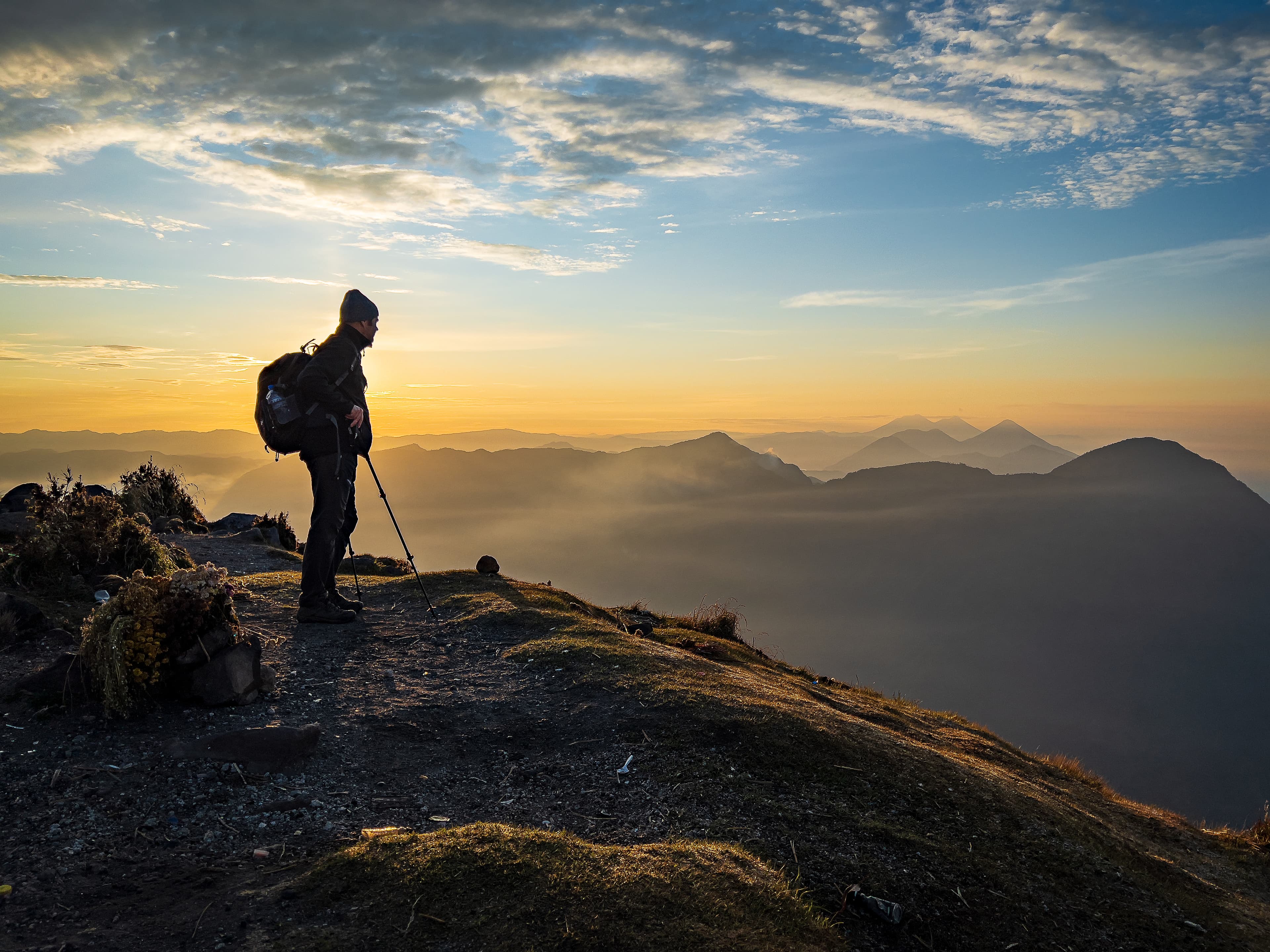 A hiker in the hills in Volcan Santa Maria, Guatemala, at Golden Hour