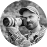 Photographer and writer Dan Mold looking through a camera