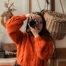 Emilie Hill portrait with camera covering eye