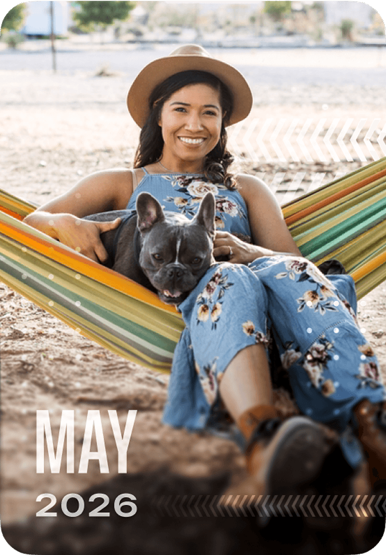 A woman in a floral dress and hat smiles while sitting in a hammock with a gray French bulldog. Text reads "May 2026" at the bottom.