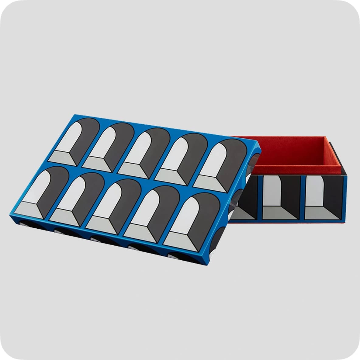 Blue box with geometric arch pattern, open to reveal a red interior, on a light gray background.