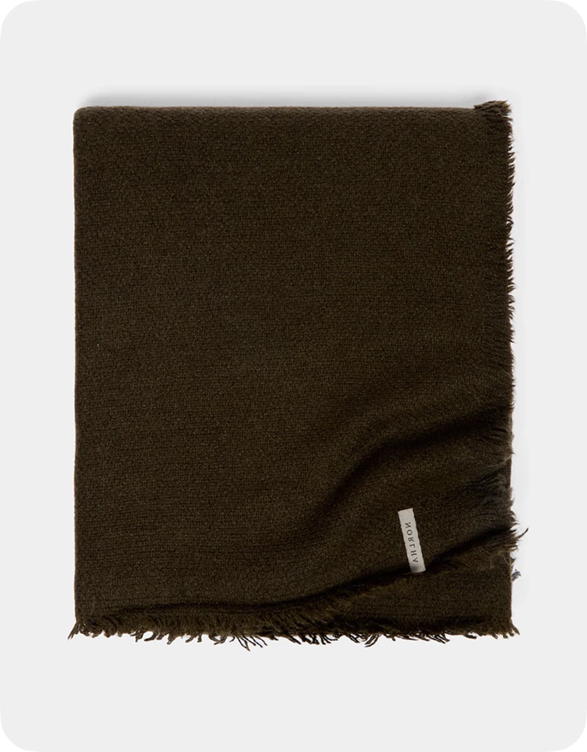 A folded dark brown scarf with a fringed edge and a small label on one side, set against a light gray background.
