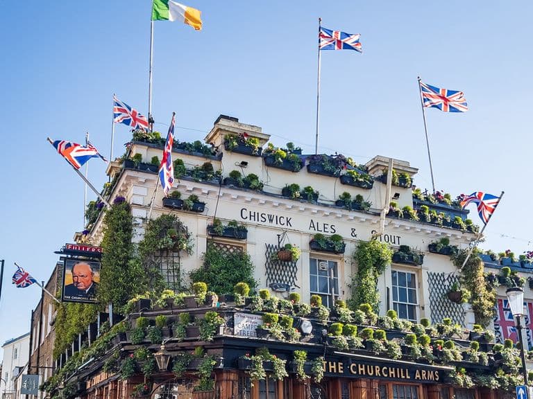 Union Jack flags decorate the roof of the Churchill Arms pub in Kensington