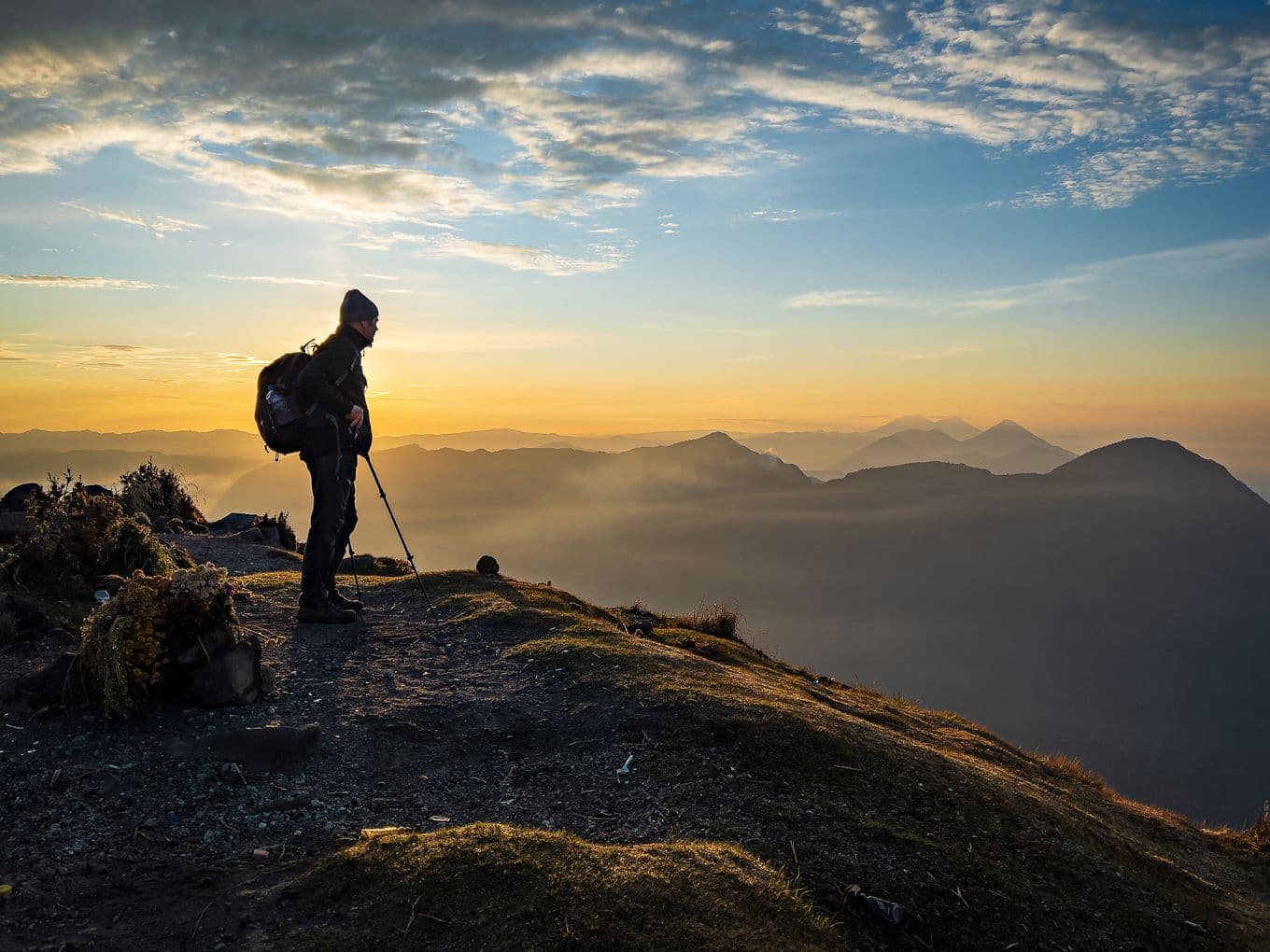 A hiker in the hills in Volcan Santa Maria, Guatemala, at Golden Hour