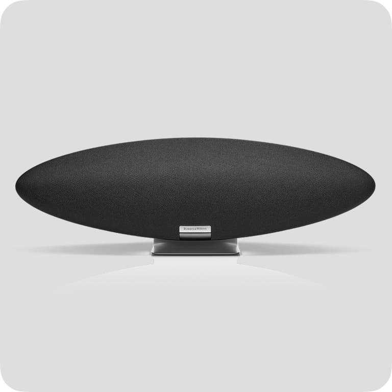 Sleek, black, oval-shaped speaker with a silver base, set against a light gray background.