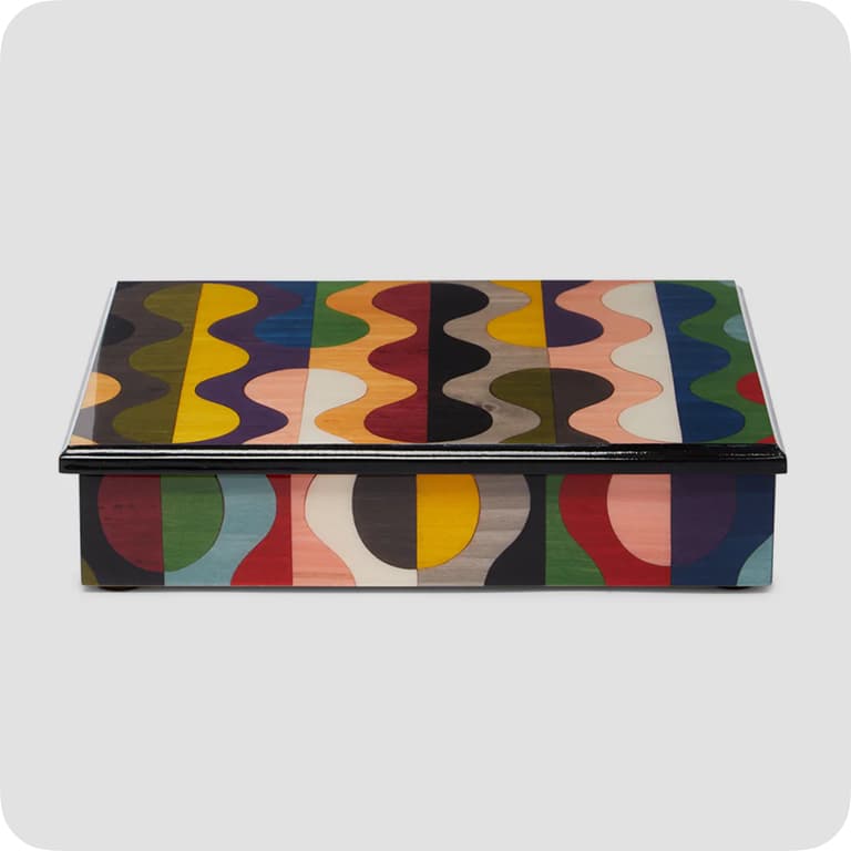 Rectangular box with a colorful, wavy geometric pattern on the lid and sides, featuring various shades of blue, green, red, yellow, and black.