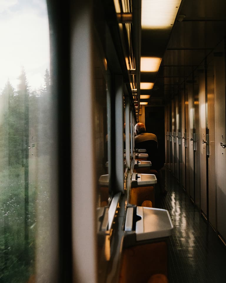 Man looking out the window of train