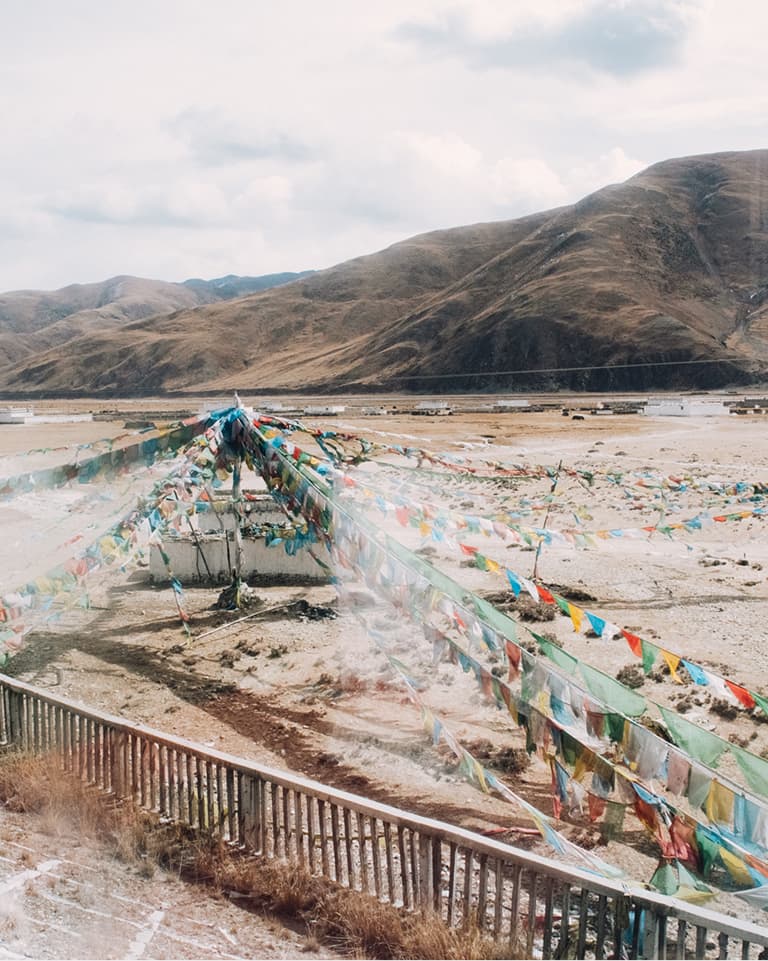 Prayer flags in Tibet seen from train window